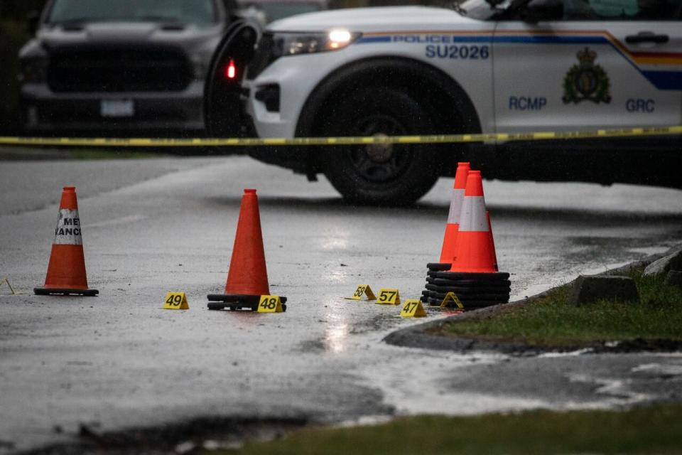 Police markers are pictured on the scene of a shooting near Roper Avenue and Parker Street in White Rock, British Columbia on Thursday, February 22, 2023. 