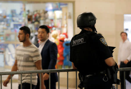 A New York Police Department (NYPD) officer stands guard in Grand Central Station, following the Nice terror attack, in New York City, U.S., July 15, 2016. REUTERS/Brendan McDermid