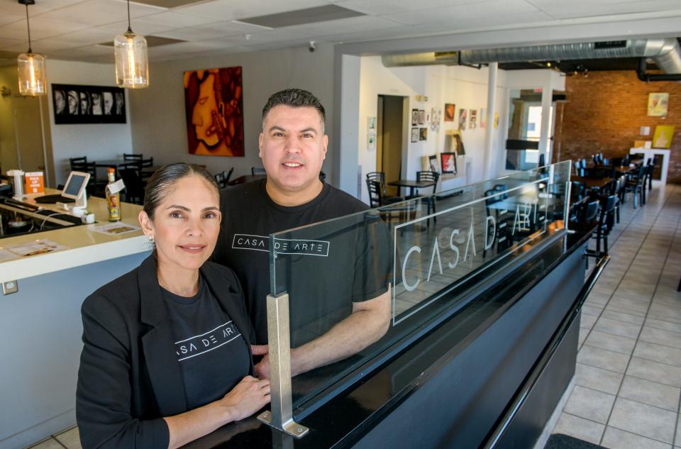 Carla Zamora-Vargas, left, and her husband Arturo Vargas are the co-owners of Casa De Arte, or "House of Art," a Mexican restaurant and bar that also serves as a gallery space for local artists. The couple opened the business in November of 2018 after purchasing the old building at 1227 SW Adams Street in Peoria's Warehouse District.