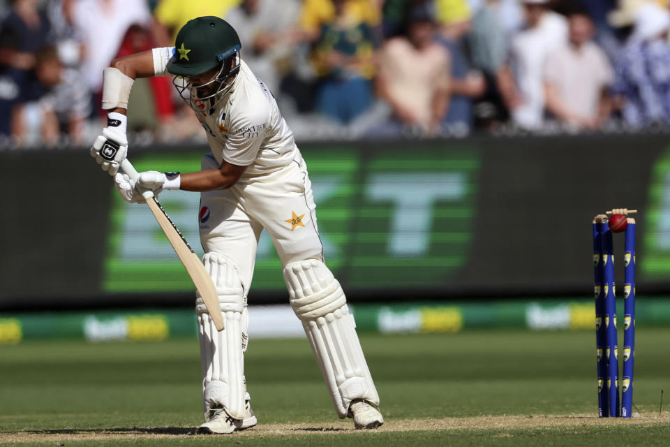Pakistan's Saud Shakeel is bowled by Australia's Josh Hazlewood during the second day of their cricket test match in Melbourne, Wednesday, Dec. 27, 2023. (AP Photo/Asanka Brendon Ratnayake)
