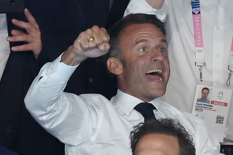 French President Emmanuel Macron celebrates after Leon Marchand of Team France wins gold in the Men's 200-m Individual Medley Final at the 2024 Paris Summer Olympic Games on Aug. 02, 2024 in Nanterre, France. <span class="copyright">Pascal Le Segretain—Getty Images</span>