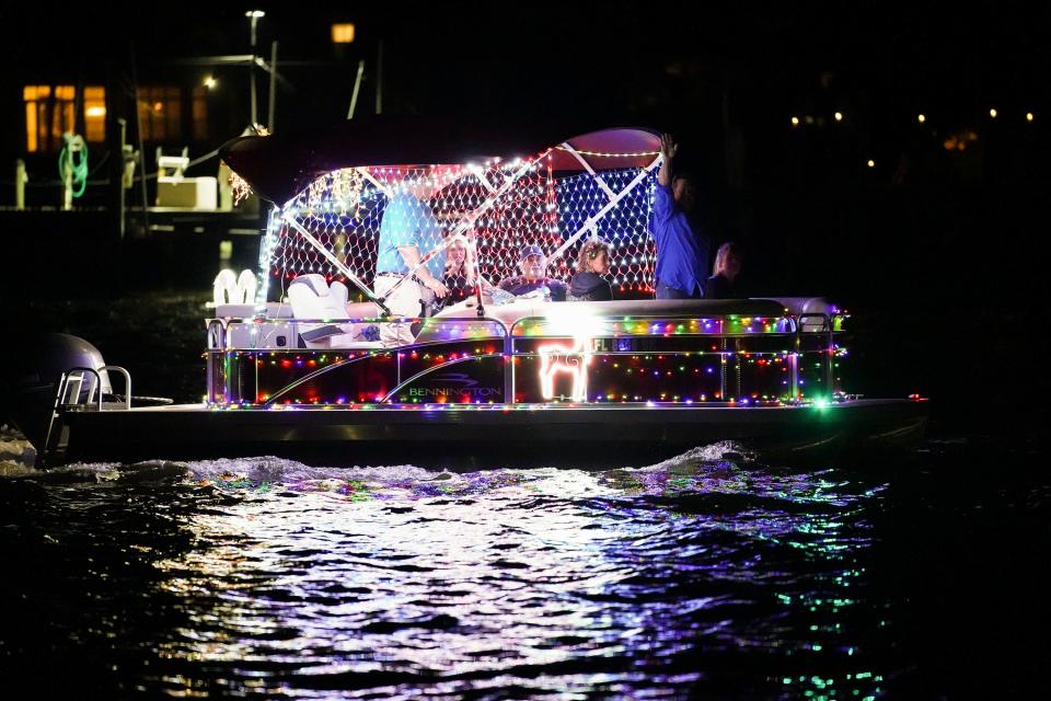 Annual boat parades across the Treasure Coast celebrate the holiday season. In this Dec. 5, 2020, photo, spectators watch as the Martin County Boat Parade passes by Sandsprit Park.