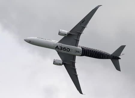 An Airbus A350 flies past during a preview aerial display of the Singapore Airshow at Changi exhibition center in Singapore February 14, 2016. REUTERS/Edgar Su