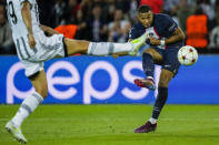 PSG's Kylian Mbappe duels for the ball during the Champions League soccer match Group H against Juventus at the Parc des Princes stadium, in Paris, Tuesday, Sept. 6, 2022. (AP Photo/Thibault Camus)