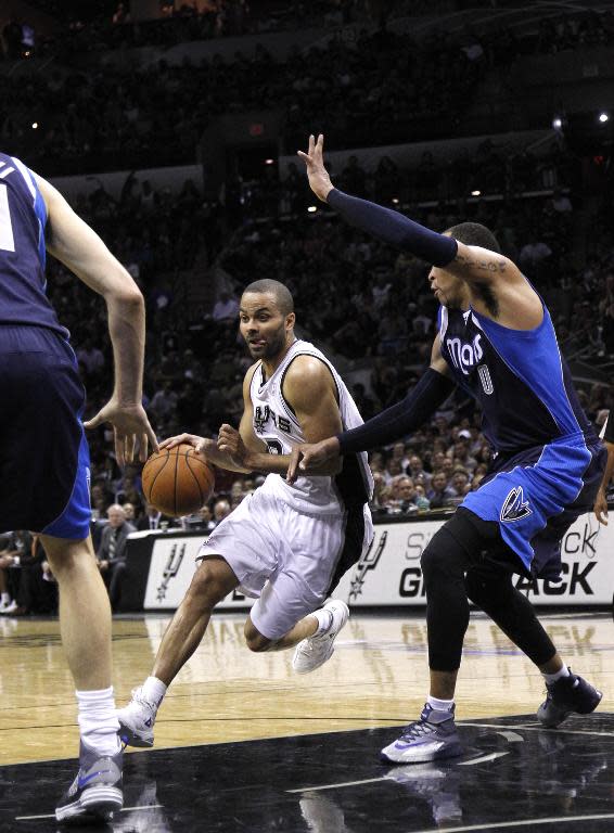 Tony Parker of the San Antonio Spurs drives around Shawn Marion of the Dallas Mavericks in Game Two of the Western Conference Quarterfinals at the AT&T Center on April 23, 2014