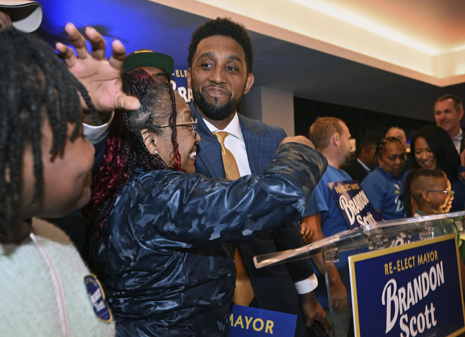 Baltimore Mayor Brandon Scott hugs mother Donna Scott before declaring victory during a Democratic primary election night watch party Tuesday, May 14, 2024, in Port Covington, Md. (Kenneth K. Lam/The Baltimore Sun via AP)