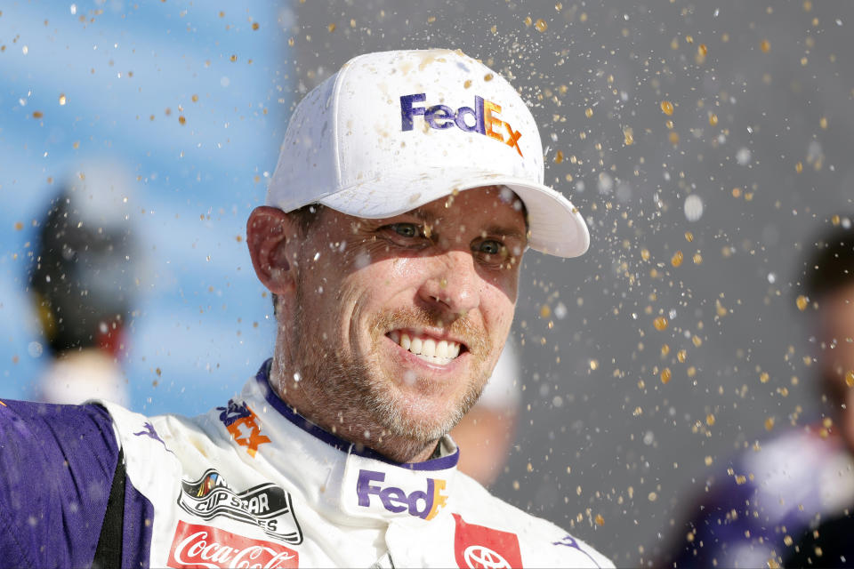 Denny Hamlin celebrates after winning a NASCAR Cup Series auto race at Kansas Speedway in Kansas City, Kan., Sunday, May 7, 2023. (AP Photo/Colin E. Braley)