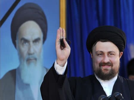 Hassan Khomeini, grandson of Iran's late leader Ayatollah Ruhollah Khomeini, waves as he speaks at a ceremony to mark the death anniversary of the Islamic Republic founder Ayatollah Khomeini at Khomeini's shrine in southern Tehran June 4, 2010. REUTERS/IIPA/Sajjad Safari/Files