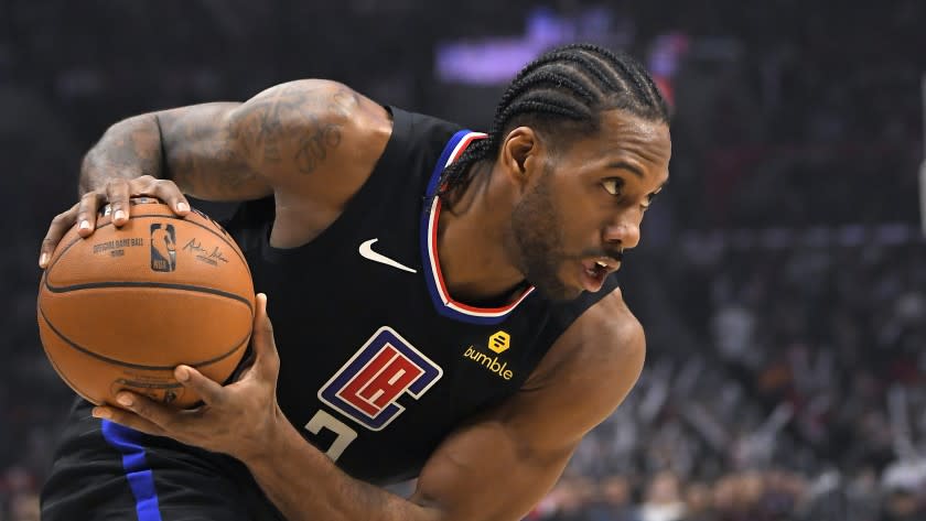 Los Angeles Clippers forward Kawhi Leonard moves toward the basket during the second half of an NBA basketball game against the Denver Nuggets Friday, Feb. 28, 2020, in Los Angeles. The Clippers won 132-103. (AP Photo/Mark J. Terrill)