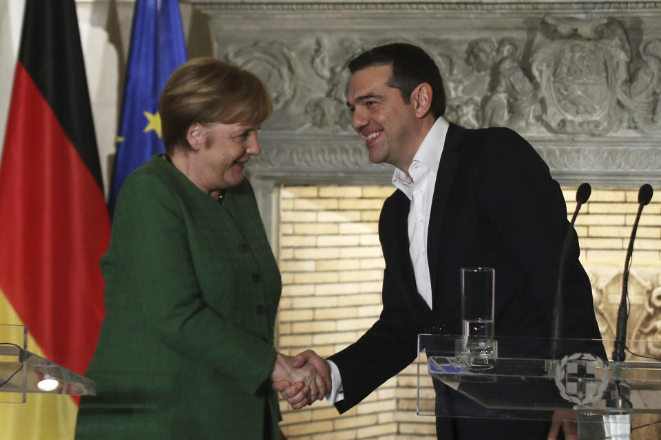 German Chancellor Angela Merkel, left, and Alexis Tsipras shake hands after a press conference in Athens, Thursday Jan. 10, 2019. Merkel is widely blamed in Greece for the austerity that the country has lived through for much of the past decade, which led to a sharp and prolonged recession and a consequent fall in living standards. (AP Photo/Petros Giannakouris)
