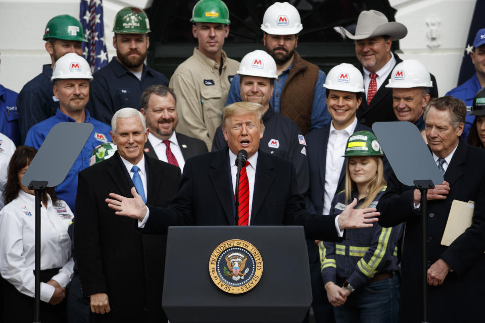 President Donald Trump speaks during an event at the White House to sign a new North American trade agreement with Canada and Mexico, Wednesday, Jan. 29, 2020, in Washington. The President is joined by Vice President Mike Pence, left, and U.S. Trade Representative Robert Lighthizer, right, and others. (AP Photo/Alex Brandon)