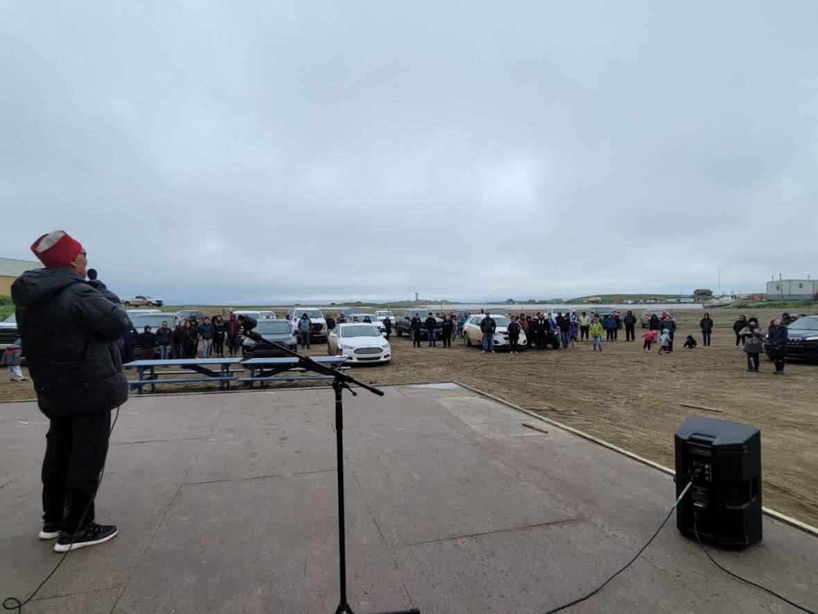 Elder and community support worker Roy Cockney Sr. speaks at a vigil July 13 in Tuktoyaktuk, N.W.T.  (Submitted by Katrina Cockney - image credit)