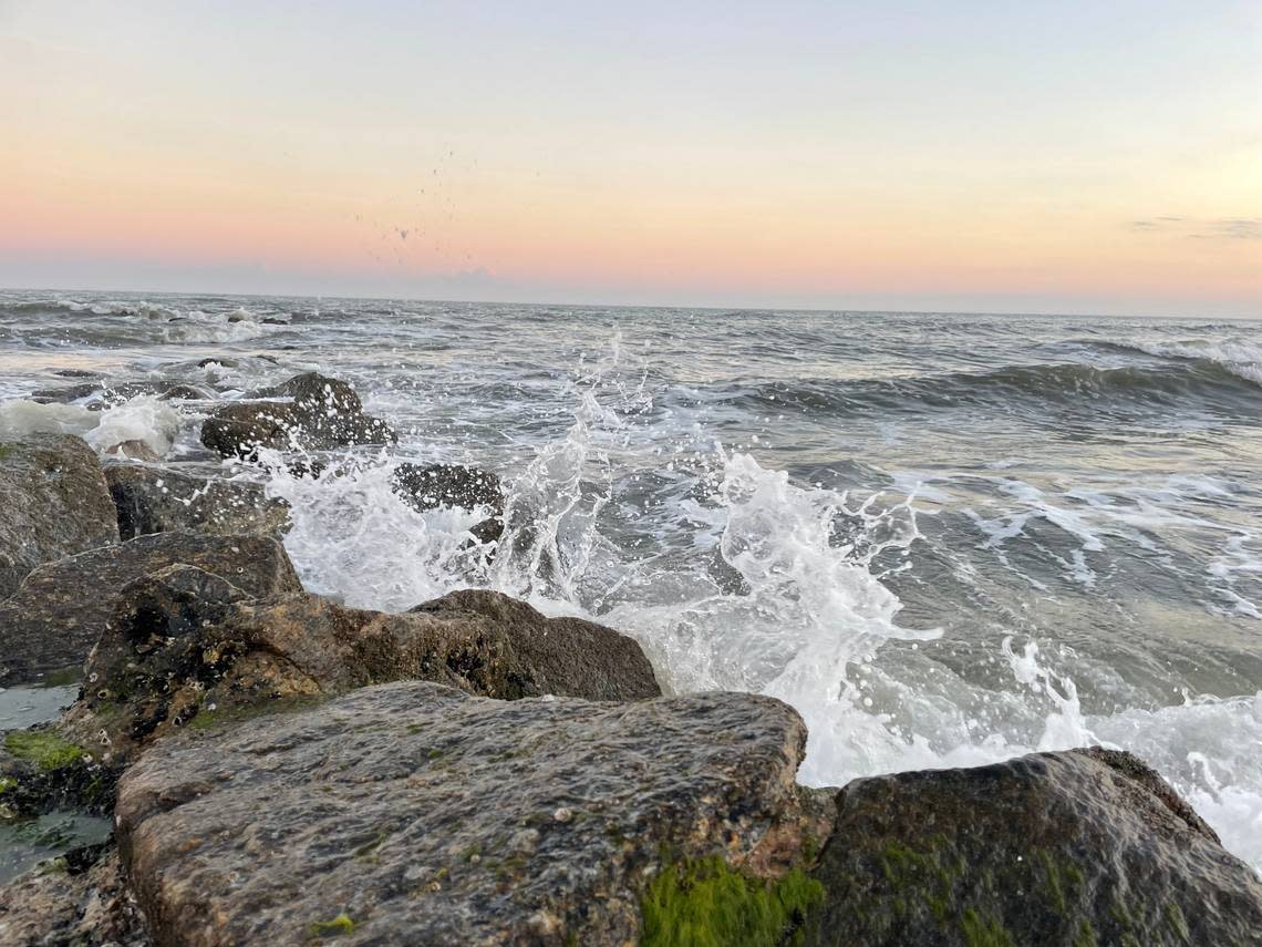 Ocean waves crash against the rocks during a Lowcountry sunset on Edisto Island, SC.