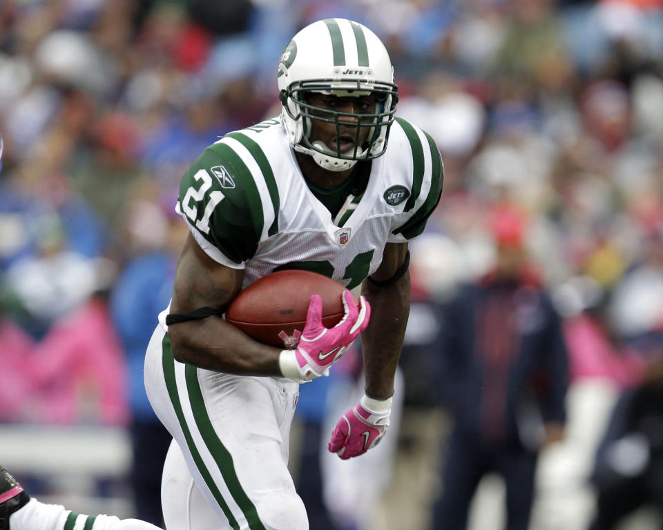 FILE - New York Jets' LaDainian Tomlinson (21) runs for a touchdown during the second half of the NFL football game against the Buffalo Bills in Orchard Park, N.Y., Oct. 3, 2010. One-time NFL MVP and Offensive Player of the Year Tomlinson was one of the most electric players in league history as a speedy and elusive double-threat out of the Chargers’ backfield. After nine seasons in San Diego, Tomlinson signed with the Jets in 2010 and helped them to the AFC title game. (AP Photo/ David Duprey, File)