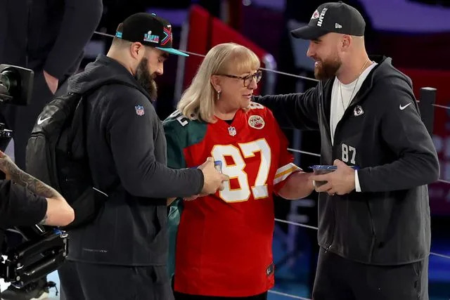 Christian Petersen/Getty Jason, Donna and Travis Kelce in Phoenix on Feb. 6, 2023