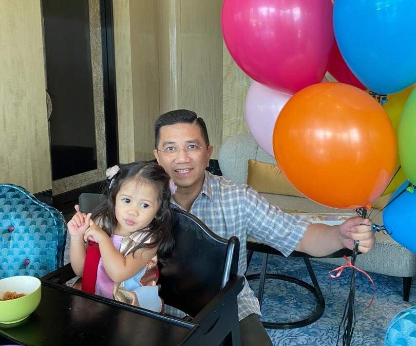 PKR deputy president Datuk Seri Azmin Ali with his birthday grandchild and balloons. — Picture courtesy of twitter.com/AzminAli