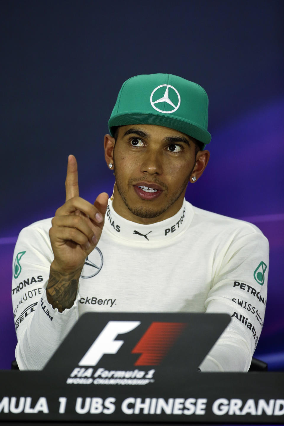 Mercedes driver Lewis Hamilton of Britain speaks during the press conference after the Chinese Formula One Grand Prix at Shanghai International Circuit in Shanghai, Sunday, April 20, 2014. (AP Photo/Alexander F. Yuan)