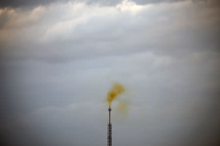 Smoke rises from a coke factory in the village of Lukavac near Tuzla, Bosnia, October 30, 2018. REUTERS/Marko Djurica/Files