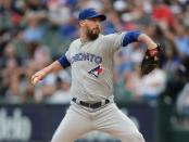 FILE PHOTO: Jul 28, 2018; Chicago, IL, USA; Toronto Blue Jays starting pitcher John Axford (77) throws a pitch during the first inning against the Chicago White Sox at Guaranteed Rate Field. Mandatory Credit: Dennis Wierzbicki-USA TODAY Sports