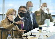 Dr. Deborah Birx, left, White House Coronavirus Response Coordinator, talks to state Senate Majority Leader Rich Wardner, R-Dickinson, North Dakota, during a round table discussion with state and local government and medical leaders on the campus of Bismarck State College on Monday, Oct. 26, 2020. Seated next to Dr. Birx is Gov. Doug Burgum, Lt.. Gov. Brent Sanford and Maj. Gen. Alan Dohrmann, North Dakota National Guard adjutant general. (Mike McCleary/The Bismarck Tribune via AP)