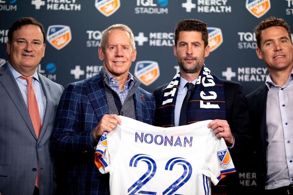 From left, FC Cincinnati president Jeff Berding, FC Cincinnati principal owner Carl Lindner III, FC Cincinnnati head coach Pat Noonan and FC Cincinnati manager Chris Albright pose for a picture at a press conference announcing Noonan as the new head coach of FC Cincinnati on Tuesday, Dec. 14, 2021. Noonan is a former assistant coach of the Philadelphia Union, where he coached from 2018 to 2021. 