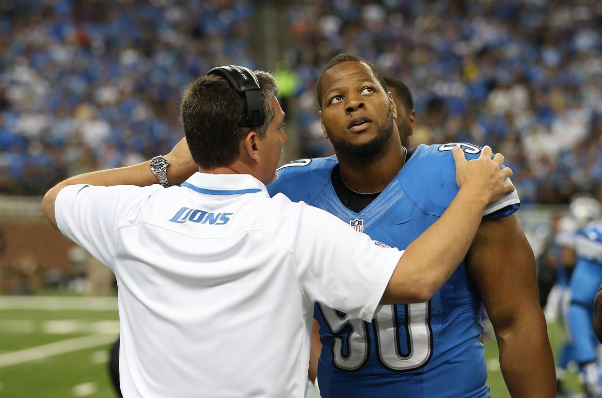 Former Detroit Lions coach Jim Schwartz, left, talks with Ndamukong Suh on the sideline Sept. 8, 2013, in Detroit. The Browns hired Schwartz as their defensive coordinator this week.