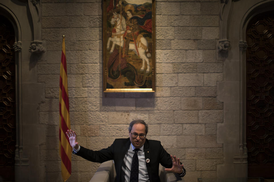 In this Thursday, Jan. 10, 2019 photo, Catalan regional president Quim Torra speaks during an interview with the Associated Press, at the Palace of Generalitat or Catalan government headquarters, in Barcelona, Spain. Catalonia separatist leader says that the Spanish government's bid to pass a national budget is doomed unless the wealthy northeastern region is allowed to hold a referendum on secession from the rest of the country. (AP Photo/Emilio Morenatti)