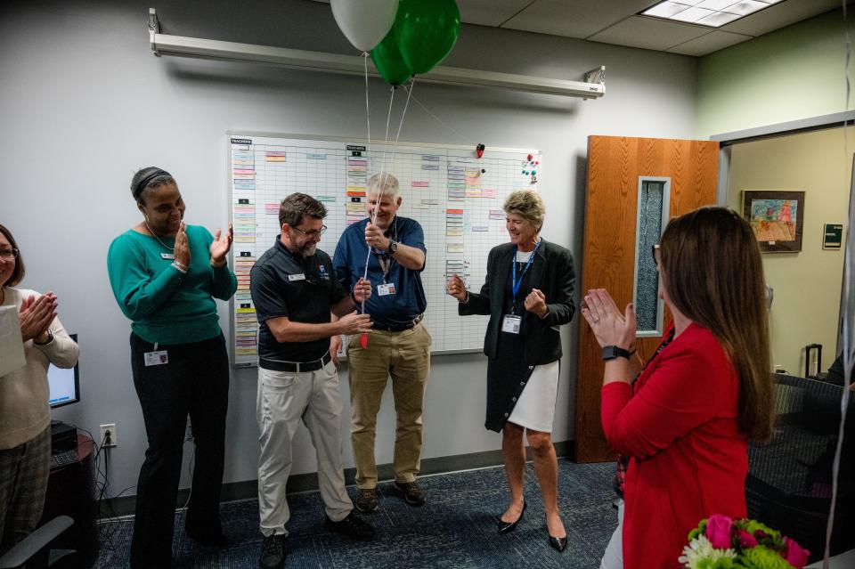 Bunnell Elementary School Principal Marcus Sanfilippo receives balloons from Chief of Operational Services Dave Freeman on Monday, Nov. 28, 2022, after receiving the district's Principal of the Year award.