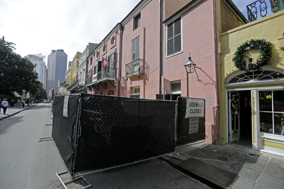 In this photo taken on Tuesday, Nov. 12, 2013, fencing blocks the exterior of the building that used to house famed Brennan's Restaurant in the French Quarter of New Orleans. Brennan’s Restaurant: “A New Orleans Tradition Since 1946,” as the website brags, is closed, the latest shoe to fall in 40 years of headline-grabbing family discord and costly litigation over matters of control, money and use of the family name at some of the establishments that trace their lineage to Owen Sr. (AP Photo/Gerald Herbert)