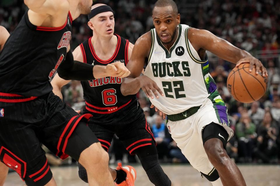 Bucks forward Khris Middleton drives past Bulls guard Alex Caruso (6) during the first half of their game Wednesday. He left the game in the fourth quarter with an MCL sprain.