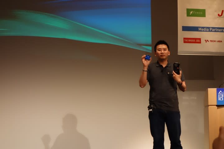 Founder and CEO Chang Chew Soon. The blue object is his company's reader.