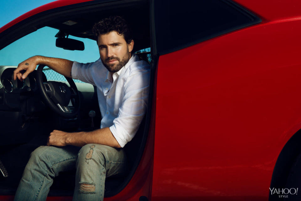 Jenner in a red sportscar wearing Calvin Klelin