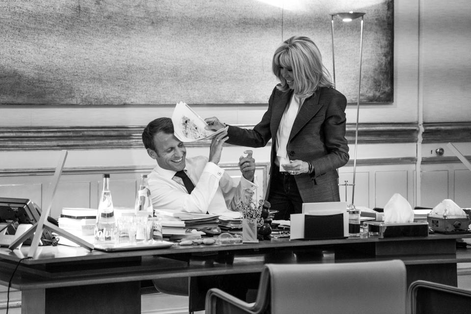 The President and his wife Brigitte share a moment as he wraps up work just before dinner | Christopher Anderson—Magnum Photos for TIME