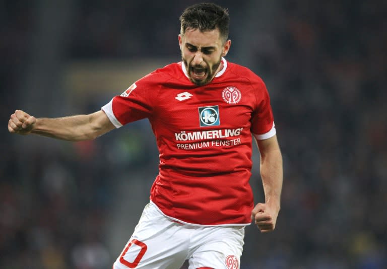 Mainz' midfielder Yunus Malli celebrates after scoring a goal during the German first division football Bundesliga match between Mainz and Wolfsburg on November 7, 2015, 2015 in Mainz, southern Germany