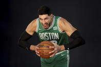 Boston Celtics center Enes Kanter yells for a photo during the Boston Celtics Media Day, Monday, Sept. 27, 2021, in Canton, Mass. (AP Photo/Mary Schwalm)