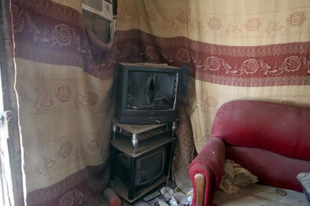 A television set is seen in a house that residents say was forcefully seized and occupied by a Boko Haram militant, in Damasak March 24, 2015. REUTERS/Joe Penney