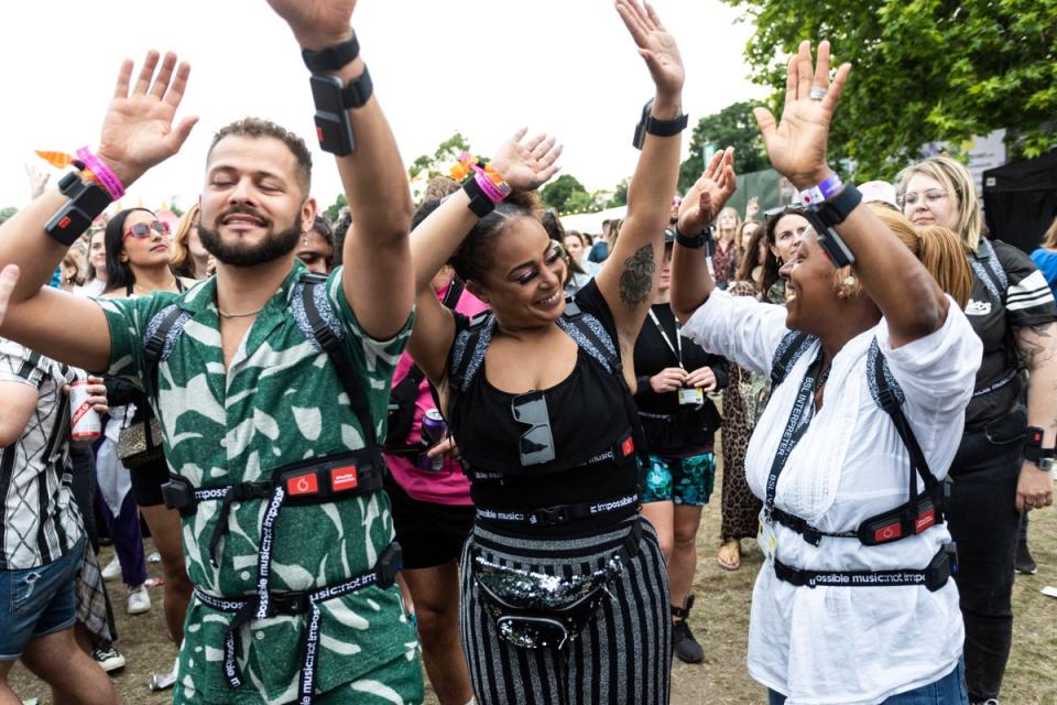 Fans trying out the ground-breaking haptic suits at the Mighty Hoopla Festival (Lee McLean/SWNS)