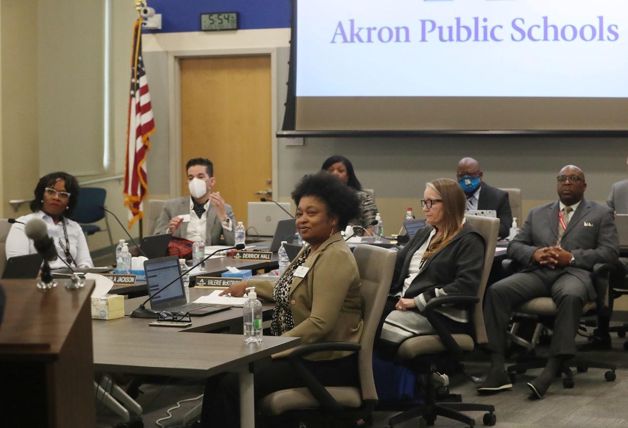 Members of the Akron Public Schools board at a 2022 meeting.