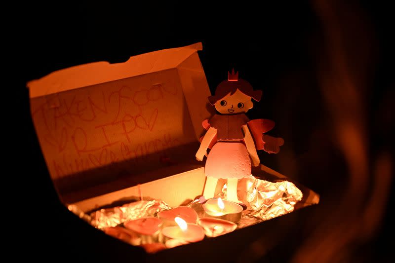 People gather for a candlelight vigil on Bondi Beach to pay respects to the victims of a fatal stabbing attack at a shopping centre in Sydney