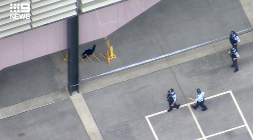 Police are seen at the school after the stabbing. Source: Nine News