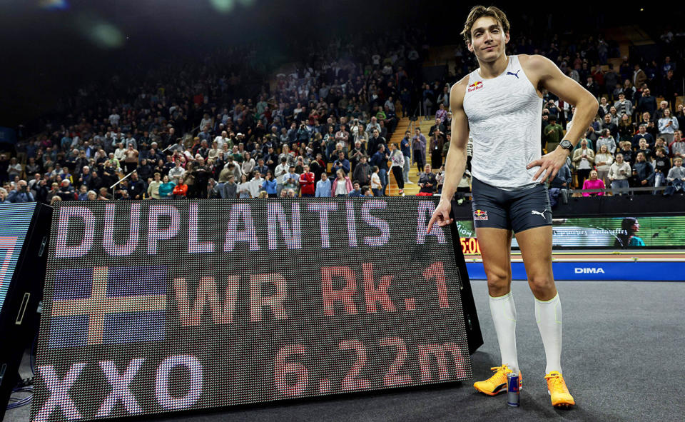 Armand Duplantis, pictured here posing for a photograph alongside his new world record. 