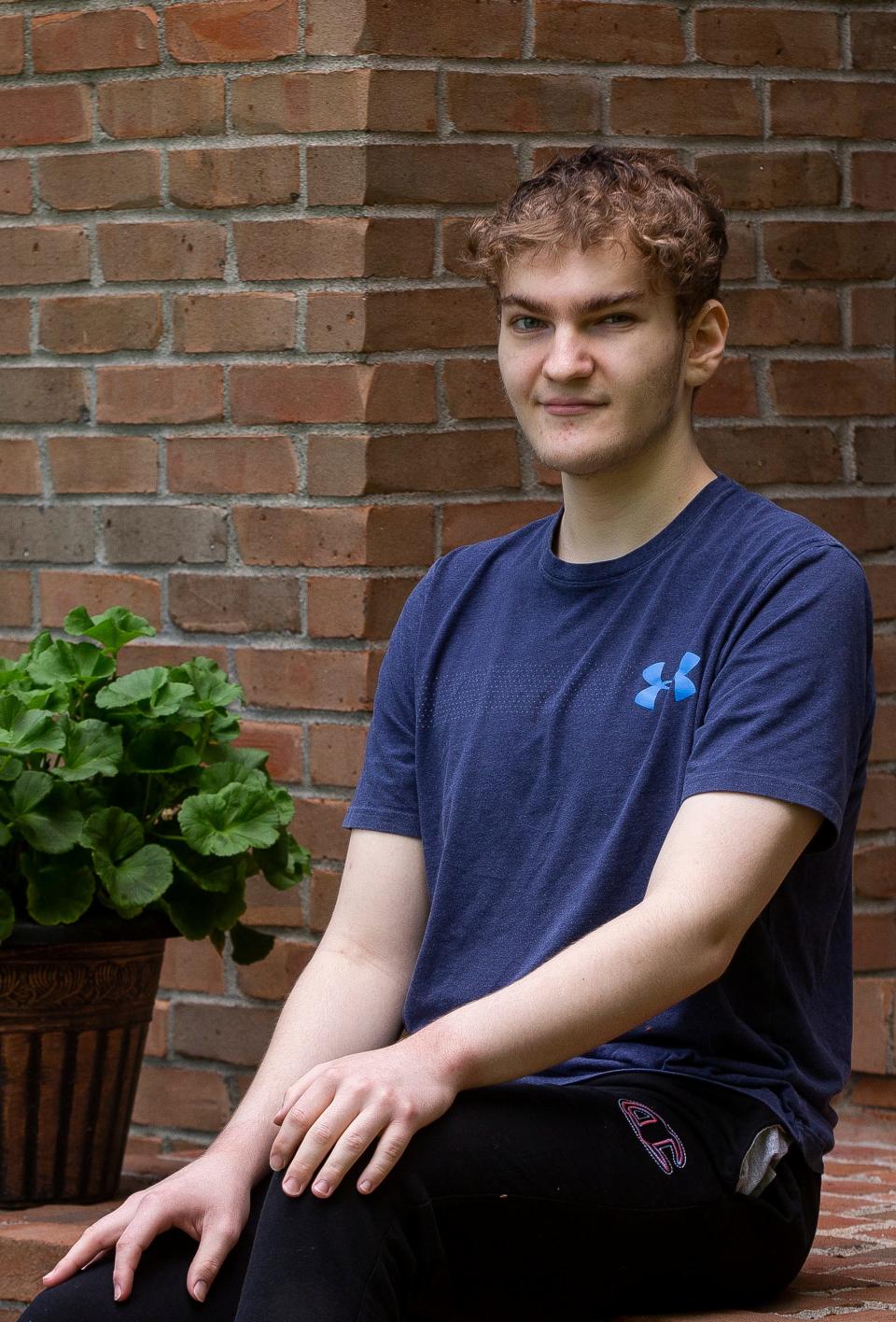 Granville High School Senior Isaac Lowry sits outside of his home in Granville High School in Granville, Ohio on May 18, 2022