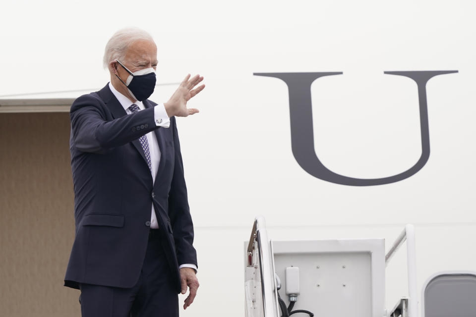 President Joe Biden waves from the top of the steps of Air Force One at Andrews Air Force Base, Md., Friday, Feb. 19, 2021. Biden is heading to Michigan to visit a Pfizer vaccine manufacturing plant near Kalamazoo. (AP Photo/Susan Walsh)