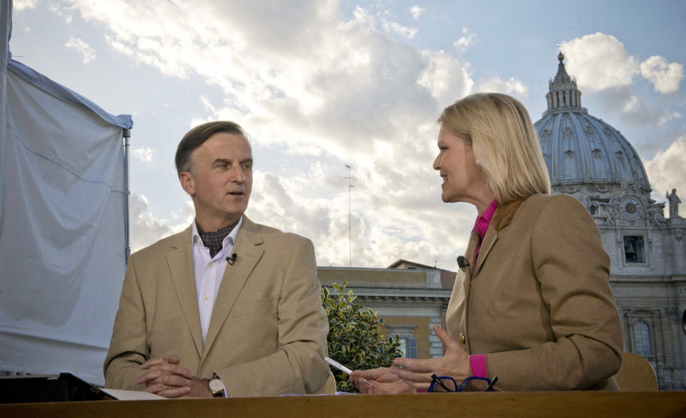 Members of a German broadcast team for the Alabama-based Eternal Word Television Network, Martin Rothweiler and Christina Blumrath, hold a discussion outside the Vatican on Friday, March 3, 2013, in preparation for the papal election. Eternal Word Television Network isn't just talking about Vatican politics or the church sex scandal in its run-up to the papal vote. Rather, "Pope TV" is airing shows about how the new man may affect church liturgy, teachings and Vatican diplomacy. The network, with 336 total employees, has about 50 staffers in Rome working on conclave coverage being aired in English, Spanish and German, said chief executive Michael Warsaw. (Jeffery Bruno/EWTN)