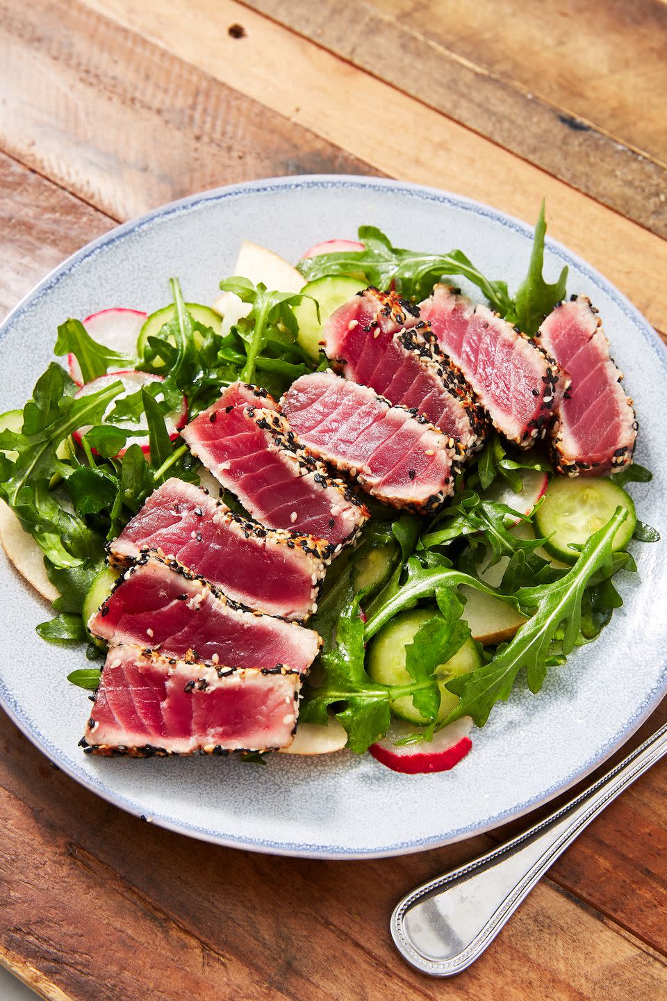 <p>We love using a slightly spicy green to counter the fatty tuna here, like <a href="https://www.delish.com/cooking/recipe-ideas/g3976/arugula-salad-recipes/" rel="nofollow noopener" target="_blank" data-ylk="slk:arugula;elm:context_link;itc:0;sec:content-canvas" class="link ">arugula</a>! It has a deliciously peppery flavor that pairs well with the quality sushi-grade ahi tuna and sweet <a href="https://www.delish.com/cooking/g695/pear-recipes/" rel="nofollow noopener" target="_blank" data-ylk="slk:pears;elm:context_link;itc:0;sec:content-canvas" class="link ">pears</a> in this salad.</p><p>Get the <strong><a href="https://www.delish.com/cooking/recipe-ideas/a26554658/seared-ahi-tuna-steak-recipe/" rel="nofollow noopener" target="_blank" data-ylk="slk:Seared Ahi Tuna & Arugula Pear Salad recipe;elm:context_link;itc:0;sec:content-canvas" class="link ">Seared Ahi Tuna & Arugula Pear Salad recipe</a></strong>.</p>