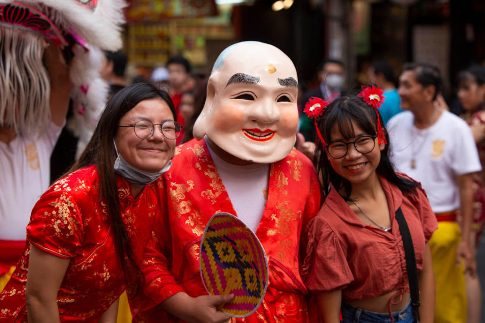 Thousands of tourists and locals flocked on 25 January 2020 to Bangkok's historic Chinatown, known as Yaowarat, to take part in festivities marking the beginning of the Year of the Rat. Dragon dance processions, attendees in traditional dress, and other festivities were put on by local cultural organizations as part of the annual event. (Photo Adryel Talamantes/NurPhoto via Getty Images)