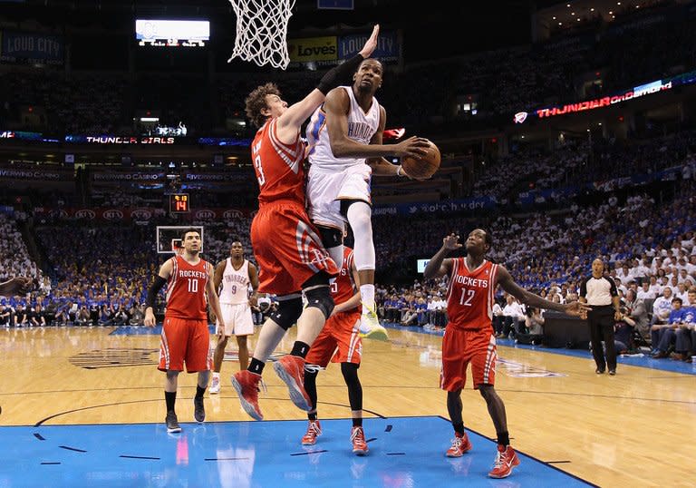 Kevin Durant of the Oklahoma City Thunder attempts a shot during the game against the Houston Rockets on April 24, 2013. Durant scored 29 points to help drive the Thunder over Houston 105-102