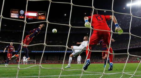 Football Soccer - FC Barcelona v Real Madrid - La Liga - Camp Nou, Barcelona - 2/4/16 Real Madrid's Karim Benzema scores their first goal Reuters / Juan Medina Livepic