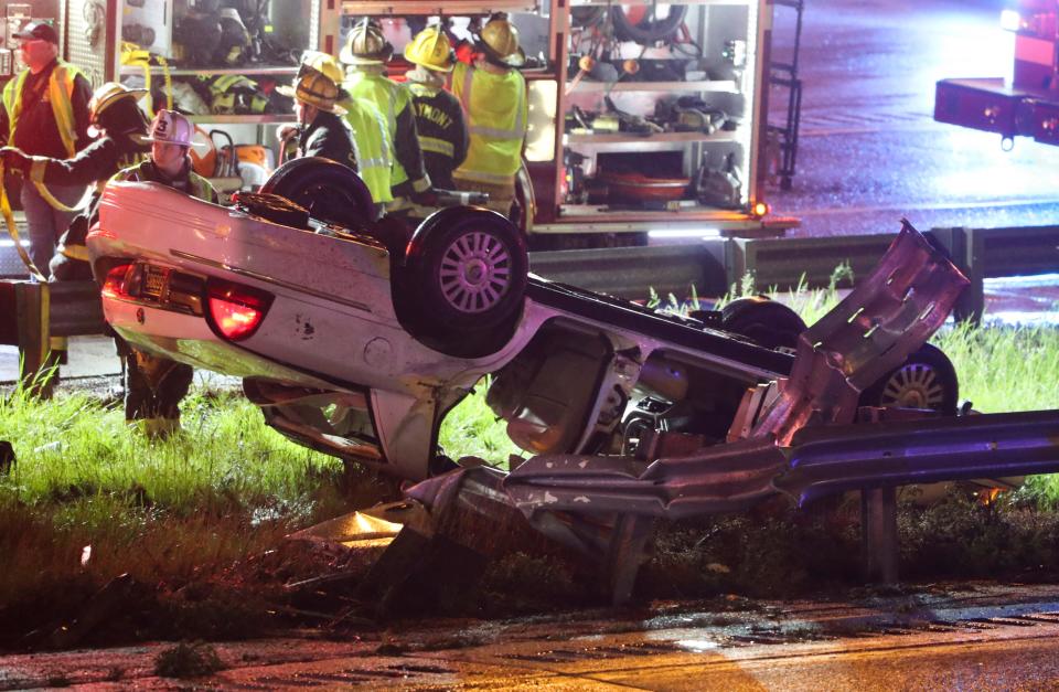 A car rests on its roof in the median of I-495 South just south of Philadelphia Pike after an accident that left one person dead shortly before 9:30 p.m. Friday, May 6, 2022 in Claymont.