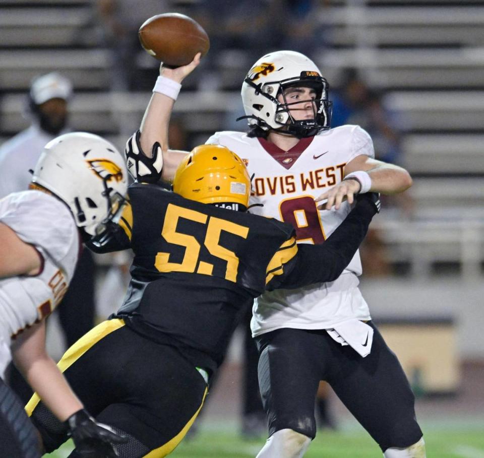 Edison’s Nick Ball, foreground, pressures Clovis West quarterback Tyler Patrick Friday, Sept. 15, 2023 in Fresno. ERIC PAUL ZAMORA/ezamora@fresnobee.com